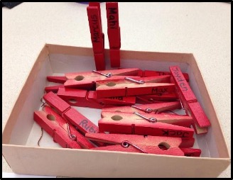 red clothes pins in box