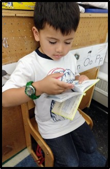 child turning page in book