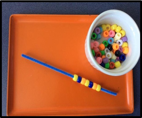 pony beads and pipe cleaner fine motor tray