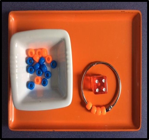 pony beads, dice, and book ring tray