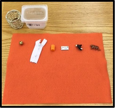 orange mat with objects on it