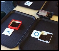 trays with letters and containers of coffee grounds