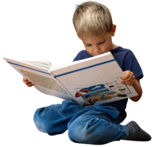 A boy reading a large book.