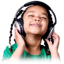 A girl wearing headphones listening to music with her eyes closed smiling.