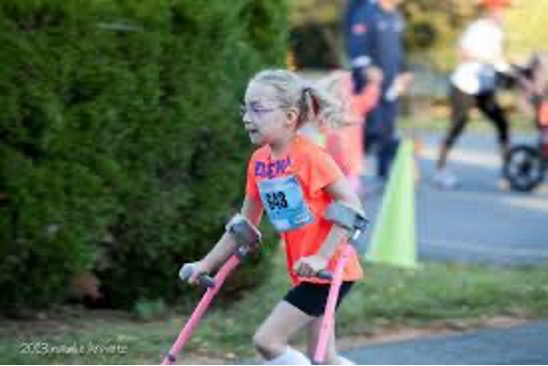 A girl running with crutches.