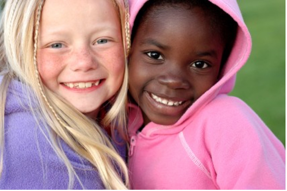 Two girls smiling.