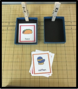 letter sound sorting activity example. 2 boxes each labeled with a letter and pictures with corresponding matching sounds. 