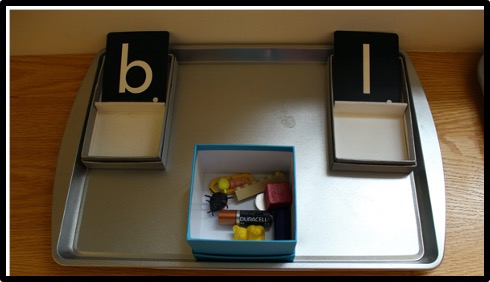 letter sound sorting activity using a baking sheet 