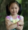 Child is showing a calm body with arms folded across chest.