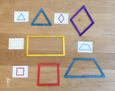 A selection of shape cards with the corresponding shapes made with popsicle sticks