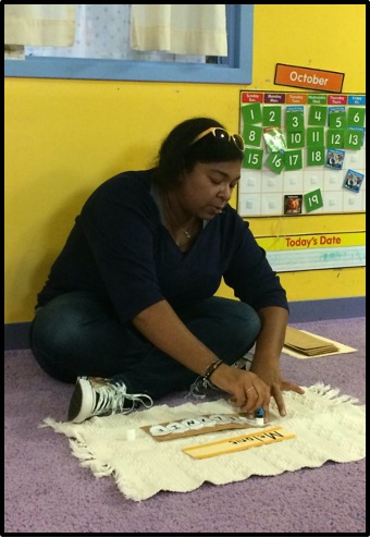 teacher modeling a name building activity during morning meeting