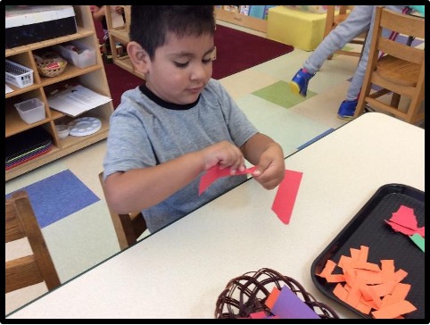 Children tearing paper