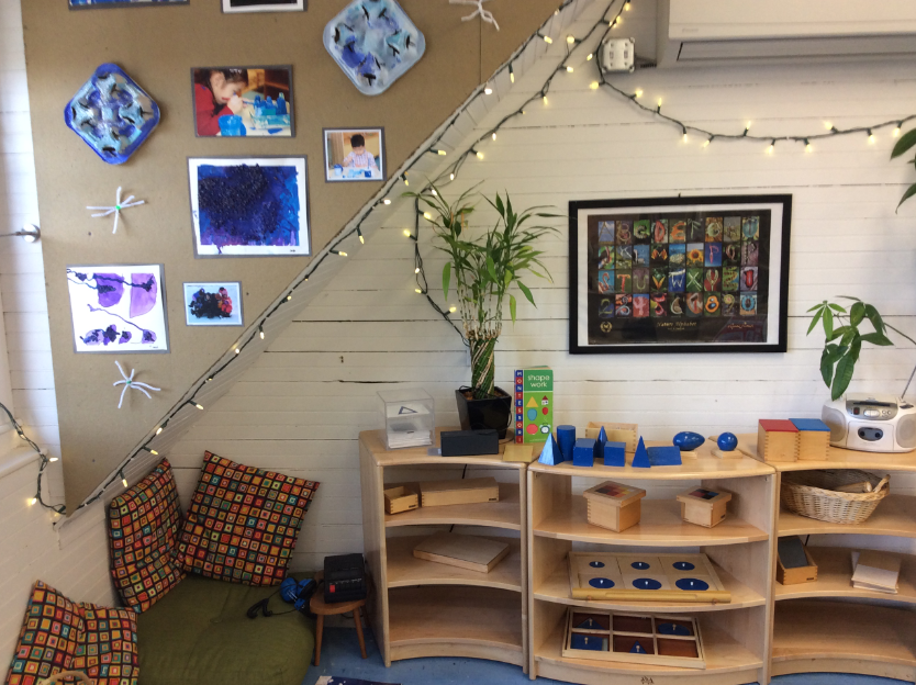 Cozy science nook next to shelf of choice activities