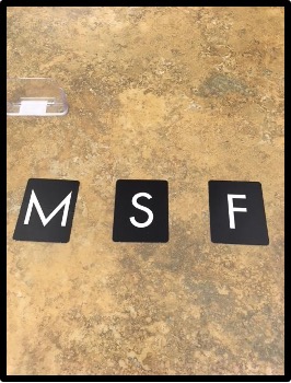 Sandpaper letters "M" "S" and "F"