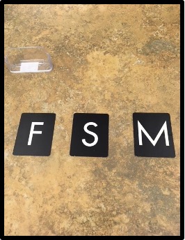 Sandpaper letters "F" "S" and "M"