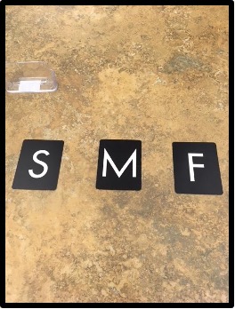 Sandpaper letters "S" "M" and "F"