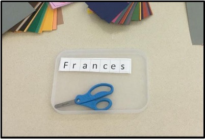 Tray with name strip and scissors