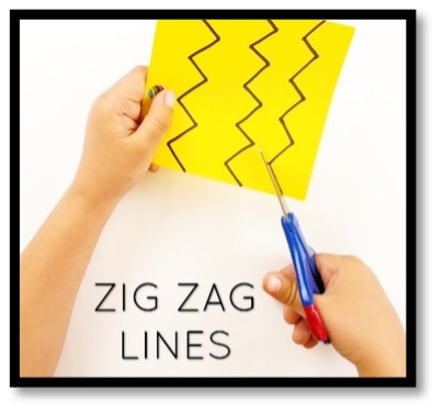 Child cutting along zig-zag lines