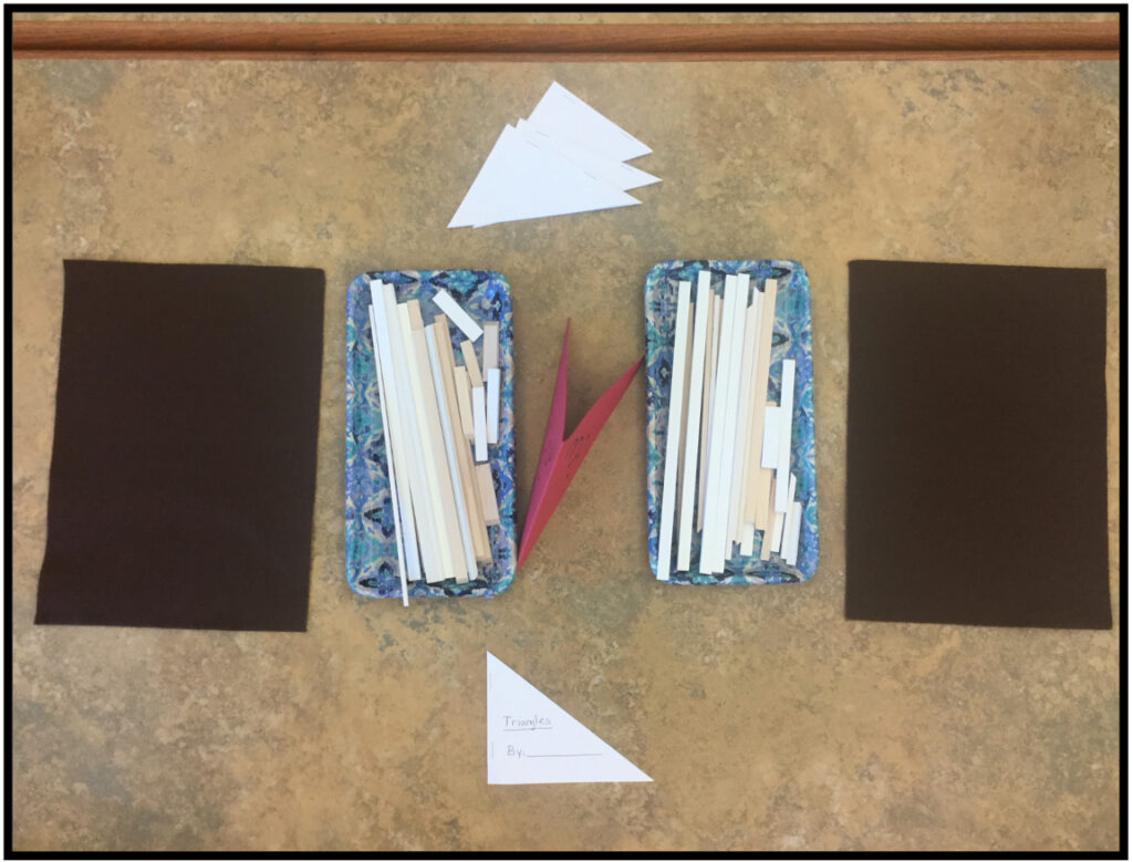 Two felt mats, triangle cutouts and two trays with a variety of length of sticks