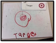 Child's drawing and word Target on a dray erase board