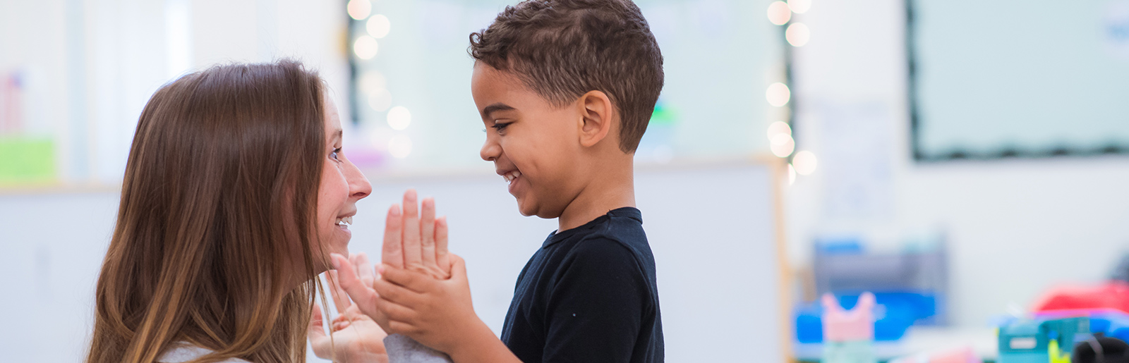 Enthusiastic teacher shares excitement with child