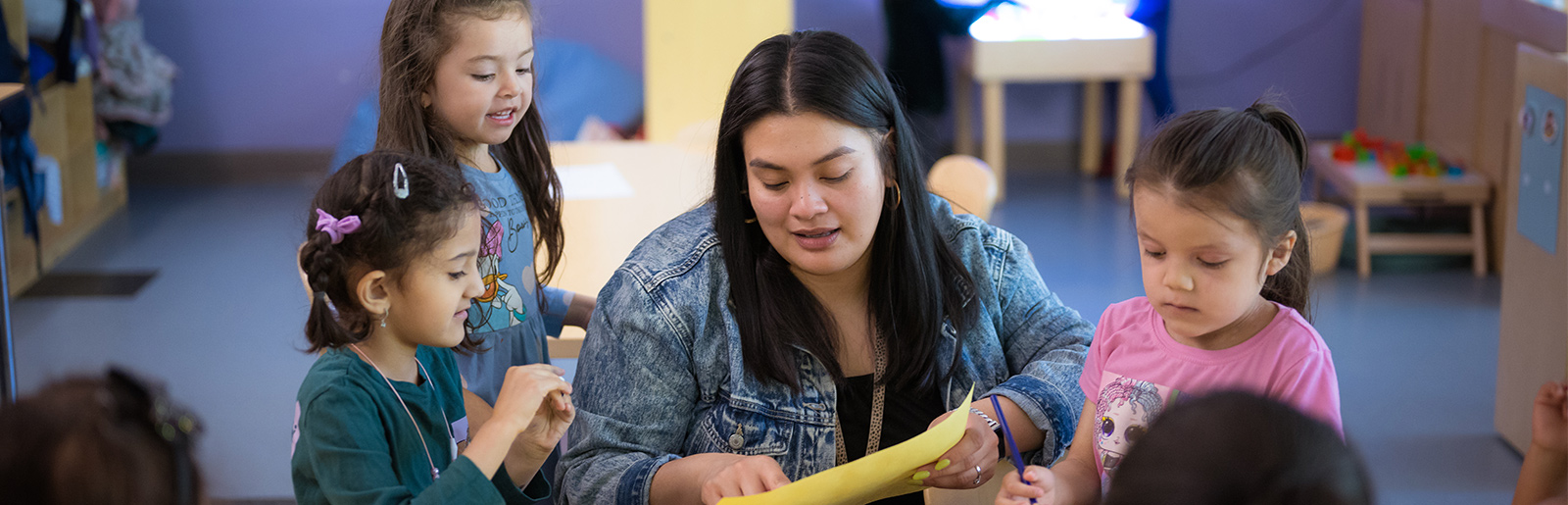 woman smiling at student working